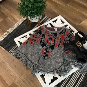 Mossimo sweater cape. Red and black print on warm gray sweater with fringe.